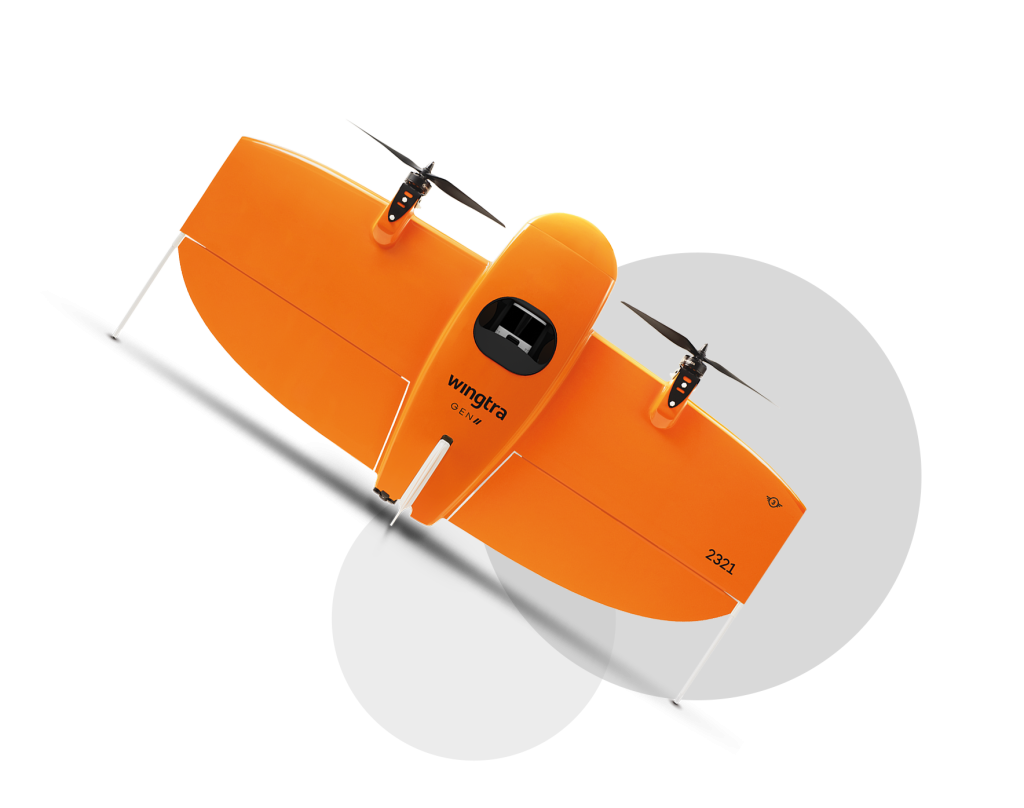 Wingtra Drohne orange mit grauen Kreisen im Hintergrund